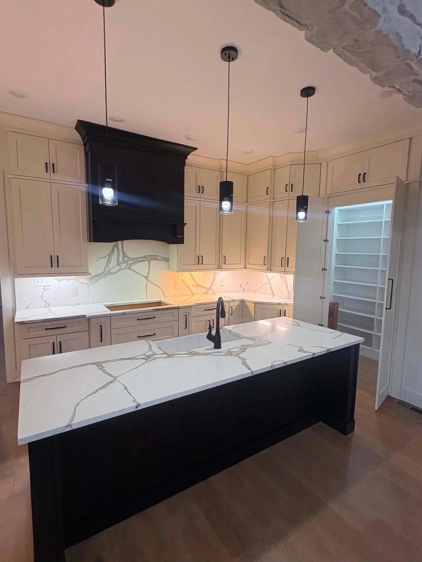 The Light Selection — Cream Run, Black Hood installed by Howard's Cabinet Installation