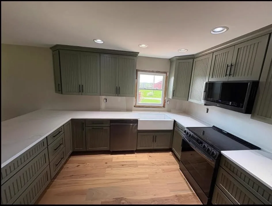Sage Green Kitchen, Long View — Kitchen cabinetry installed by Howard's Cabinet Installation