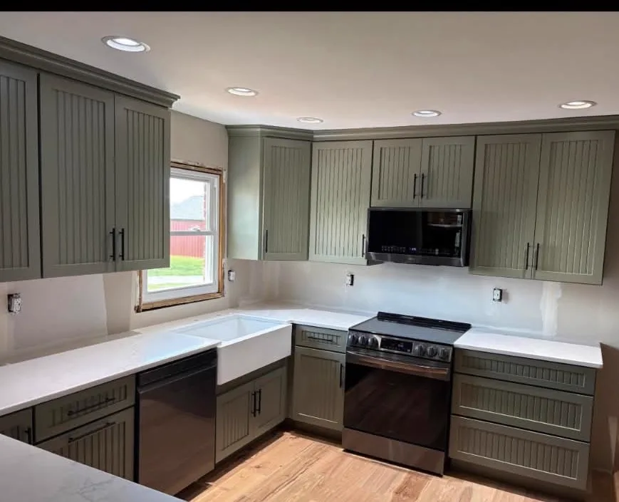 Sage Green Kitchen — Kitchen cabinetry installed by Howard's Cabinet Installation