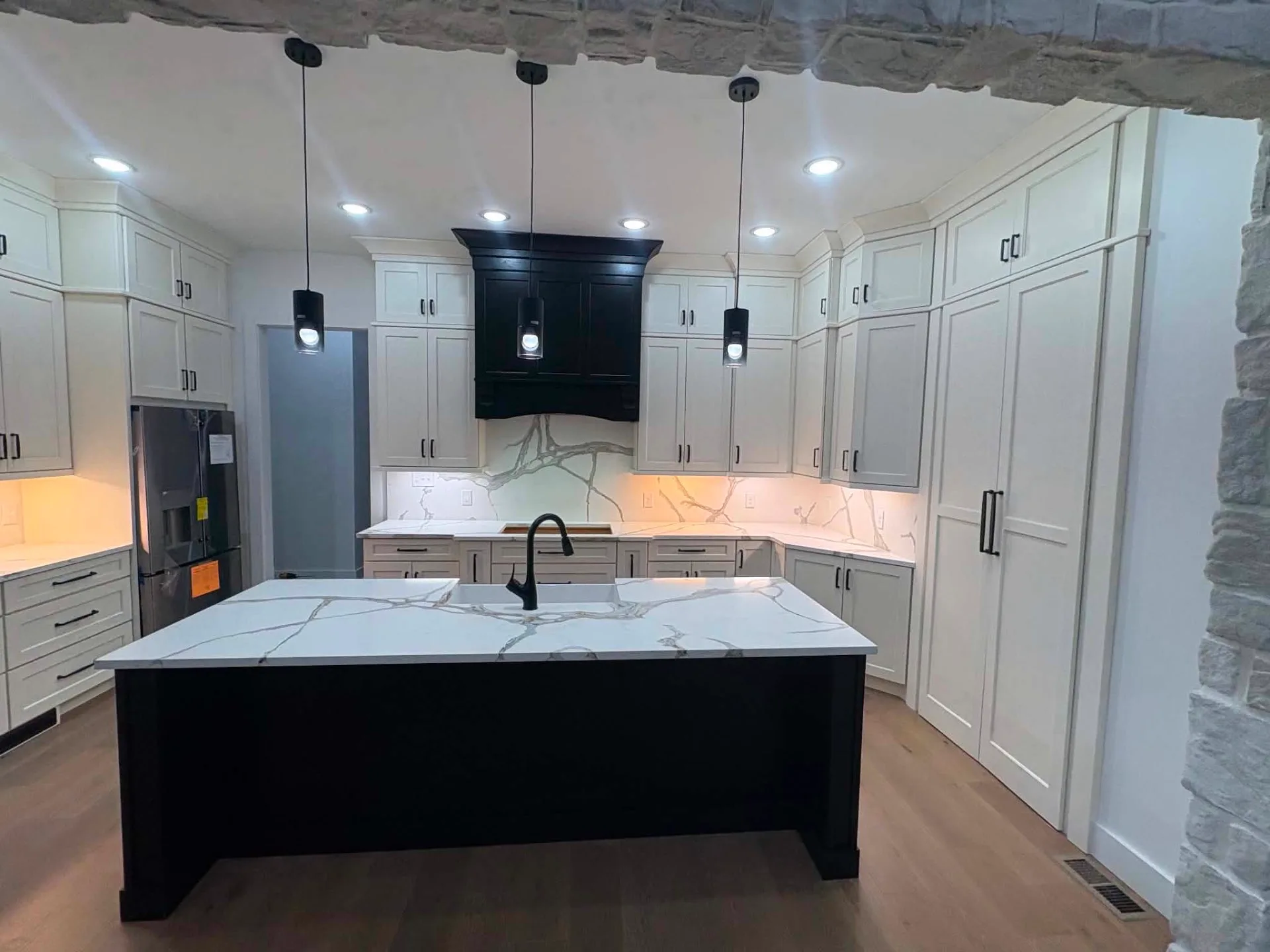 Black Island Under Stone — Kitchen cabinetry installed by Howard's Cabinet Installation